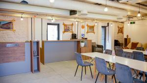 a room with a table and chairs and a kitchen at Chechakar Boutique Hotel in Ditavan