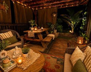 a patio with a table and chairs and candles at Sunset Calm Retreat Bungalow in Haleiwa +12 photos