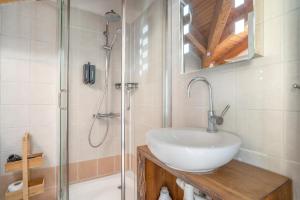 a bathroom with a sink and a shower at Pilali Apartments Greece in Agia Effimia +41 photos