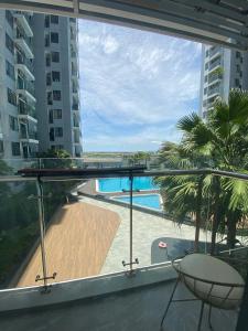a balcony with a view of a swimming pool at Căn hộ Vip 2Phòng ngủ - Huế Ơi 3 in Hue
