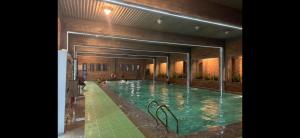 a large swimming pool in a building at miniHomestay green view & warm pool - all apartment - 3 room - 6 persons - Ea Kar - Dak Lak in Buôn Mhang