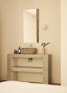 a bathroom with a sink and a mirror at Design Cabin with Plunge Pool in Ahangama