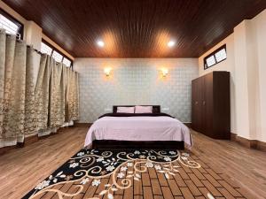 a bedroom with a bed in a room at Valley Roots Homestay in Ziro +6 photos