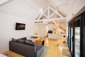 a living room with a couch and a table at Pedras Salgadas Spa & Nature Park in Pedras Salgadas