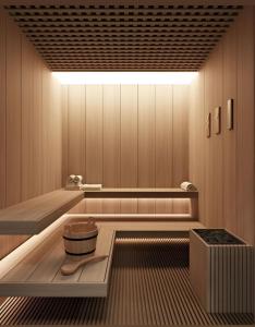 a sauna with a large light on the ceiling at Hotel Magnific in Kranevo
