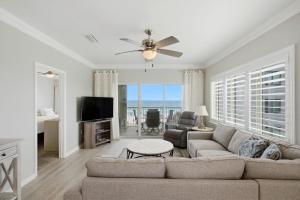 a living room with a couch and a television at Marlin Key 2A in Orange Beach