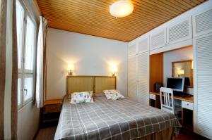 Кровать или кровати в номере Katinkulta Apartments