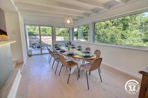 a dining room with a table and chairs at Ty gouldri in Perros-Guirec