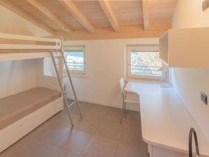 a small room with a bunk bed and a desk at EnjoyIseoLake - Lake View Paradise in Parzanica +22 photos