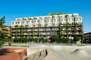 a large building with a skate park in front of it at Ohboy Hotell in Malmö