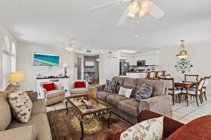 a living room with a couch and a table at The Palms #601 in Fort Walton Beach