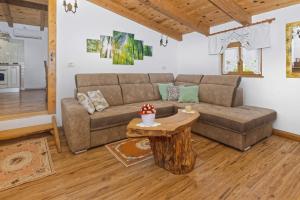 a living room with a couch and a table at Casa Mira by Rent Istria in Pazin
