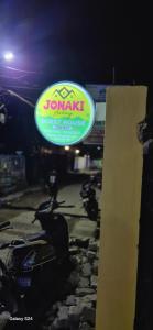 a sign for a yamaha motorcycle dealership at night at Jonaki Aalay-Cozy and Budget Stay-Ulubari in Guwahati
