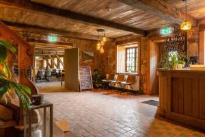 a room with a bar and chairs in a building at lignely in Durbuy