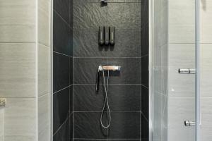 a bathroom with a shower with a glass door at Casa do Recanto - Loriga - Serra da Estrela in Loriga +42 photos