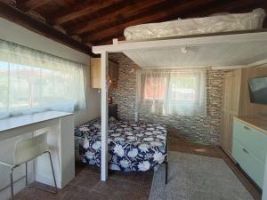 a small bedroom with a bed and a window at Villa Shiva Cerveteri, Casa Vacanze con SPA e Idromassaggio, Relax a due passi da Roma in Cerveteri