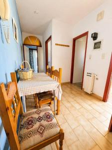 a dining room with a table and chairs at Asterias in Koronisía +38 photos