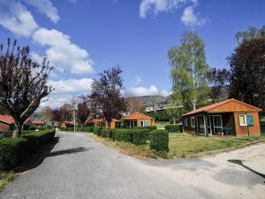 a small house on the side of a road at Camping Onlycamp l'Astrée in Bourg-Argental