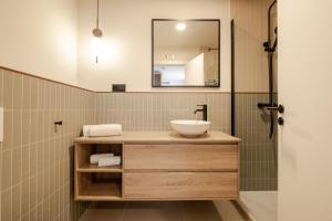 a bathroom with a sink and a mirror at Flipco Retiro in Madrid +26 photos