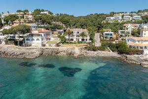 an aerial view of a beach with houses at Apartment Vida Sana by Sealand Villas in Alcudia