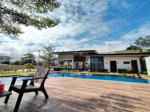 a house with a swimming pool and a bench at Zefe's Hideout in Lapu Lapu City