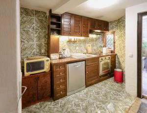 a kitchen with a sink and a microwave at Apartment Stern in Perast +27 photos
