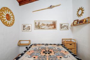 a bedroom with a bed and a clock on the wall at Casa Gianpiero San Teodoro in San Teodoro