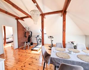 a gym with a table and chairs in a room at visit baltic - Villa Blue Marine in Świnoujście