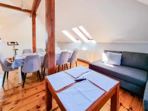 a living room with a couch and a table at visit baltic - Villa Blue Marine in Świnoujście