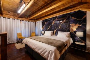 a bedroom with a large bed in a room at Waterkloof Apartments in Pretoria