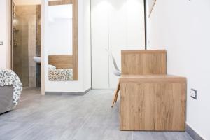 a bathroom with a wooden cabinet and a mirror at Casa Corvaja in Taormina +64 photos