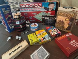 a table with a bunch of games and other items at Cha-am Pool Villa in Ban Bo Prakhon +45 photos