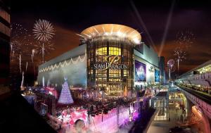 a large building with a christmas display in front of it at G Boutique Silom Hotel in Bangkok