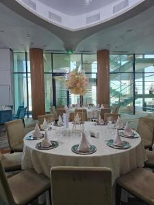 a dining room with a table with napkins on it at Hotel Delta 3 in Tulcea