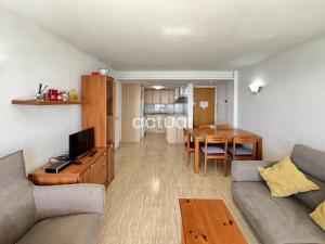 a living room with a couch and a table at President A-9 in Platja d'Aro