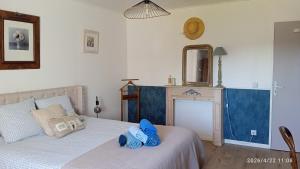 a bedroom with a bed with blue towels on it at Le Ronsard in Blye +94 photos