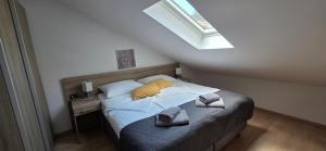 a bedroom with a bed with two pillows on it at Villa Kristina in Rovinj