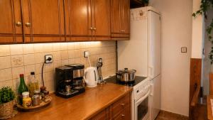 a kitchen with a counter top with a coffee maker at Argyroupolis Dimitris Rooms in Argyroupolis +27 photos