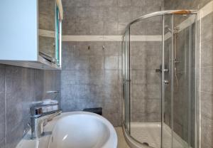 a bathroom with a sink and a shower at Staytopus Offshore Marsalforn Budget Room for Divers & Travelers in Marsalforn +33 photos