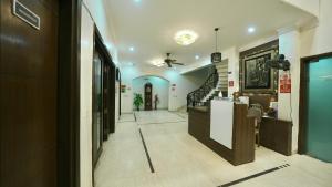 a hallway of a house with a staircase in it at Rustam Villa Sector 39 in Gurgaon
