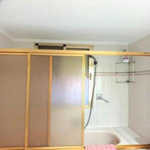a shower with a glass door in a bathroom at San Jose Luminoso in Algemesí