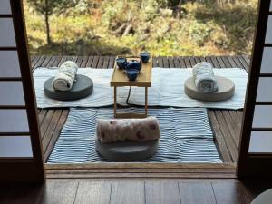 a view of a table with hats on a deck at 風まち in Yawatano