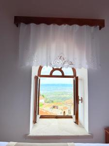 a window in a bedroom with a view at Vila Kalaja Kruje, Inside The Castle in Krujë