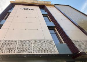 a building with a design on the side of it at Hotel The Galaxy in Dabok