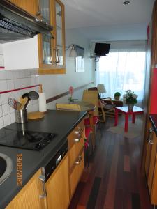 a kitchen with a sink and a counter top at Studio Face Mer in Quend-Plage