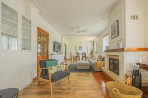 a living room with a fireplace and a couch at Sea Garden in Mendiondo