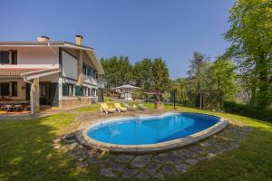 a swimming pool in the yard of a house at Sea Garden in Mendiondo