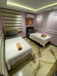 a room with two beds and a couch at Avullar Palace Hotel in Antalya +72 photos