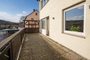 a balcony with a view of a building at Boutique Hotel an der Mosel - ehemalig Hotel Kreuter in Koblenz