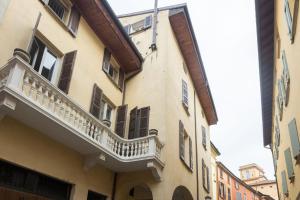 a building with a balcony on the side of it at Nel Cuore di Bologna V ,Bologna by Shortholidays in Bologna